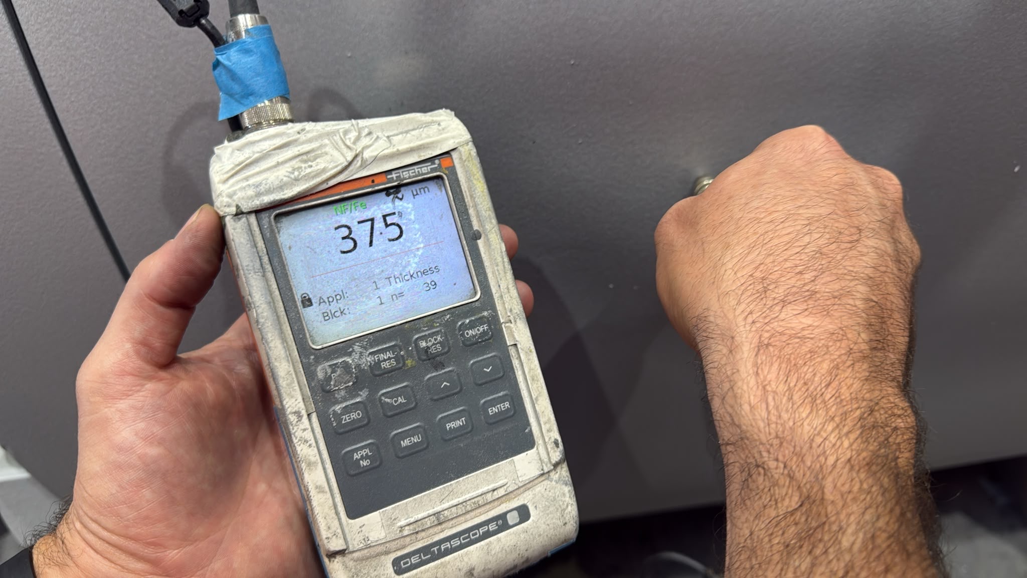 Dry film thickness measurement on a coated surface